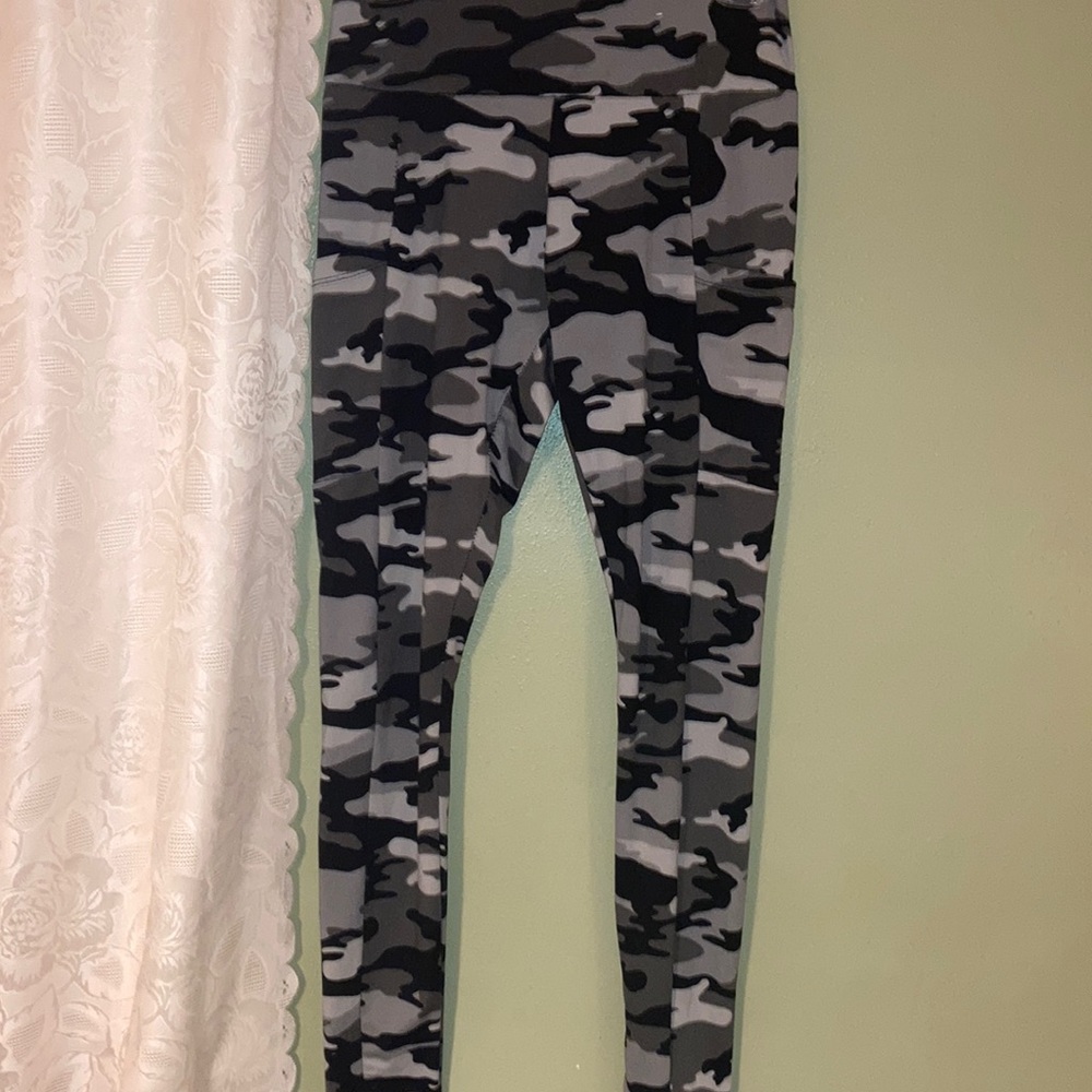 Rue 21 Camouflage leggings with pockets on side. Green black
